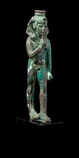 * An Egyptian Bronze Striding Harpokrates Height 5 3/4 inches.