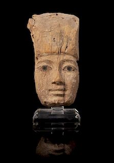 * An Egyptian Painted Wood Mummy Mask Height 8 1/4 inches.