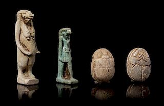 * An Egyptian Faience Amulet of Taweret, Two Faience Scarabs and an Egyptian Amulet of Horus Height of tallest 1 5/8 inches.