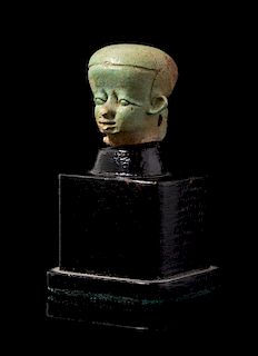 * An Egyptian Faience Head of Pataikos Height 3/4 inches.