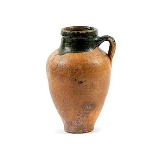 An Islamic Green Glazed Pottery Vessel Height 11 1/2 inches.