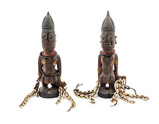 A Pair of Yoruba Twin Ibeji Figures Height 10 1/4 inches.