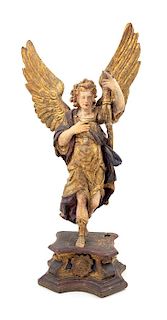An Italian Painted and Gilt Figure of an Angel Height of figure 29 1/2 inches.