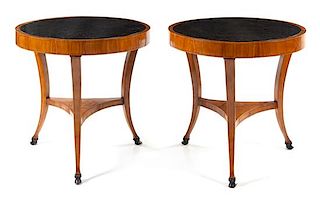 A Pair of Italian Neoclassical Parcel Ebonized Fruitwood Tables Height 32 x diameter of top 32 inches.