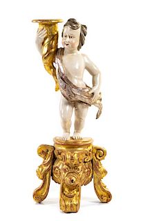 An Italian Painted and Parcel Gilt Figural Torchere Height 38 1/4 inches.