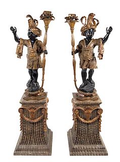 A Pair of Venetian Style Figural Torcheres Height of figures 52 3/4 inches.