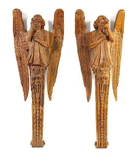 A Pair of Continental Carved Figures of Angels Height 62 x width 24 inches.