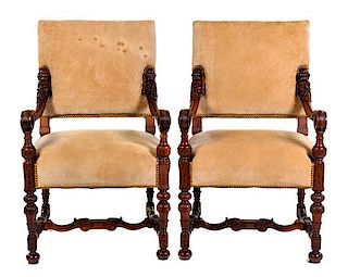 A Pair of Continental Walnut Armchairs Height 39 inches.