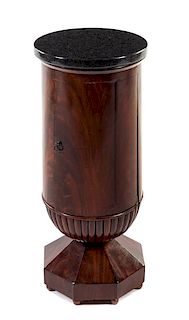 An Austrian Mahogany Pedestal Cabinet Height 32 1/2 x diameter of top 14 1/8 inches.