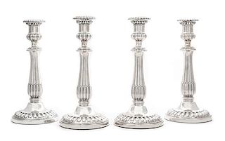 A Set of Four George III Silver Candlesticks, John Roberts & Co., Sheffield, 1808-9, each having an urn form candle cup with a g