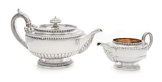 A George III Silver Teapot and Creamer, Paul Storr, London, 1810, each of squat baluster form with an egg-and-dart decorated rim