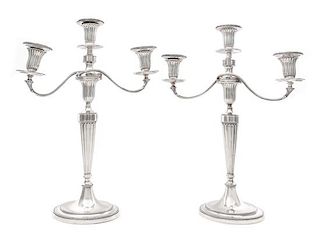 A Pair of George III Silver Three-Light Candelabra, John Schofield, London, 1781; the Branches Marked for 1796, each fluted tape