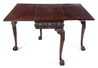 A George II Mahogany Drop-Leaf Table Height 28 x width 36 1/2 x depth 18 inches (closed).