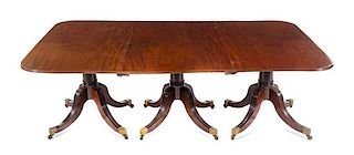 A George III Style Mahogany Triple-Pedestal Dining Table Height 28 x length 112 3/4 x depth 52 1/4 inches.