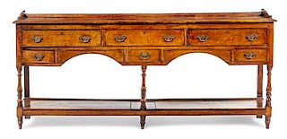 * A George III Provincial Oak Sideboard Height 35 1/2 x width 83 1/2 x depth 16 1/2 inches.