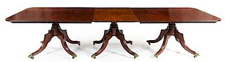An Irish Regency Mahogany Convertible Dining Table Height 29 x width 49 1/2 x length 181 1/4 inches (fully extended).