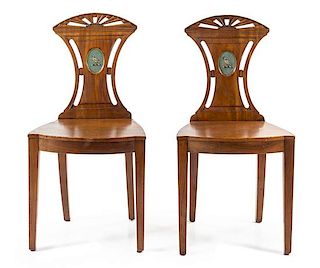 A Pair of Regency Mahogany Hall Chairs Height 35 inches.
