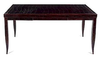 An Art Deco Style Embossed Leather-Veneered Writing Table Height 30 1/2 x width 53 x depth 33 inches.