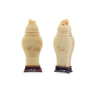 A Pair of Chinese Carved Stone Vases Height of covered vase 10 1/2 inches.