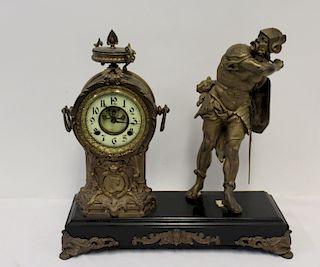 Patinated Metal Figural Clock With Open Escapement