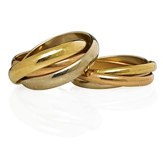 TWO CARTIER TRINITY 18K GOLD ROLLING RINGS