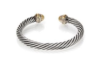 * A Sterling Silver and 14 Karat Yellow Gold Cable Bracelet, David Yurman. 28.00 dwts.