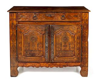 A Louis XV Provincial Carved Walnut Cabinet Height 40 3/4 x width 48 7/8 x depth 22 3/4 inches.