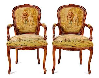 A Pair of Louis XV Fruitwood Fauteuils Height 37 inches.