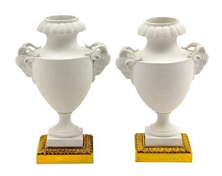 A Pair of French Gilt Bronze Mounted Bisque Porcelain Urns Height 10 inches.