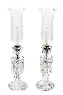 A Pair of Baccarat Etched Glass Hurricane Candlesticks Height 11 5/8 inches.
