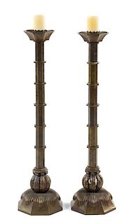 A Pair of Italian Bronze Pricket Sticks Height 39 inches.