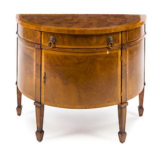 An Italian Style Burlwood Demilune Commode Height 32 1/8 x width 41 1/2 x depth 20 7/8 inches.