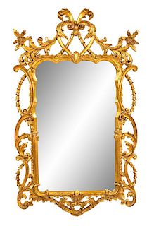 An Italian Giltwood Mirror Height 47 x width 28 inches.