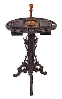 A Black Forest Carved Smoking Stand Height 35 inches.