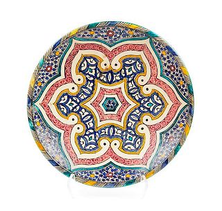 A Middle Eastern Glazed Ceramic Charger Height 3 1/2 x diameter 15 5/8 inches.