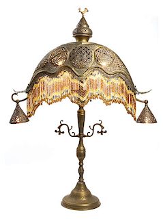 A Turkish or Egyptian Pierced Brass Table Lamp Height 41 inches.