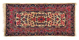 Two Wool Rugs Larger example: 4 feet 9 inches x 2 feet 5 1/2 inches; smaller example: 4 feet 1 inch x 1 foot 11 inches.
