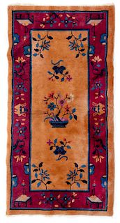 A Chinese Wool Rug 4 feet 9 inches x 2 feet 6 inches.