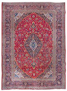 * A Tabriz Wool Rug 9 feet 8 inches x 12 feet 9 inches.