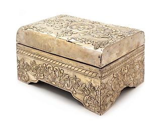 A Silver-Clad Table Casket, 20th Century, the domed hinge top centered with a paterae among foliate scrolls.