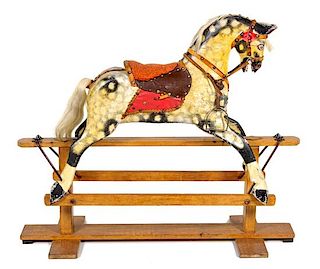 An American Painted Rocking Horse Height 40 x width 48 inches.