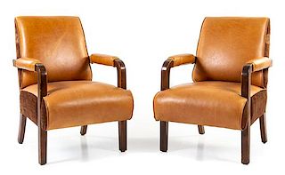 A Pair of Leather Upholstered Pullman Car Armchairs Height 33 x width 23 1/2 x depth 24 3/4 inches.