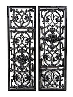 A Pair of Cast Iron Grates Height of each 40 x width 13 1/2 inches.