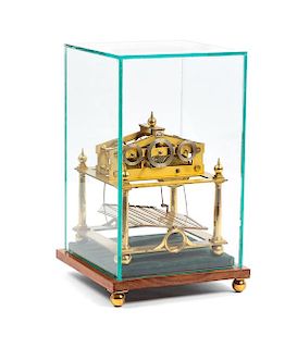 A Brass Congreve Rolling Ball Clock Height of clock 9 1/2 x width 7 1/2 inches.