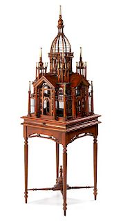 A Victorian Style Mahogany Bird Cage Height overall 71 x width 20 3/4 x depth 20 5/8 inches.