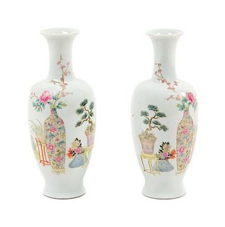 A Pair of Famille Rose Porcelain Vases Height 7 inches.