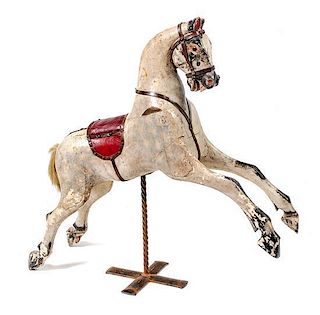 A Carved Wood Figure of a Horse Height 37 inches x length overall 38 inches.