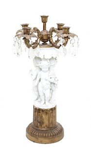A Gilt Metal and Bisque Porcelain Five-Light Candelabrum Height 22 1/8 inches.