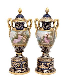 A Pair of Lidded Porcelain Urns Height 12 1/2 inches.