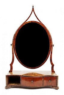 A George III Mahogany Shaving Mirror Height 29 1/2 x width 17 3/4 x depth 9 inches.